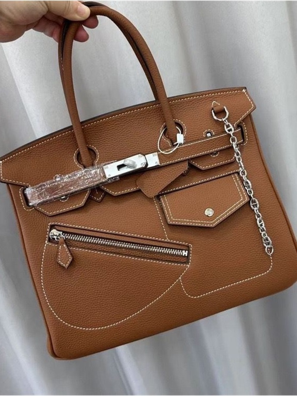 Coming Soon 30 cm genuine leather with silver hardware and a silver chain."